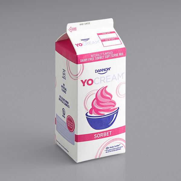 A white carton of Dannon YoCream Low Fat Mango Sorbet Mix with pink lettering.