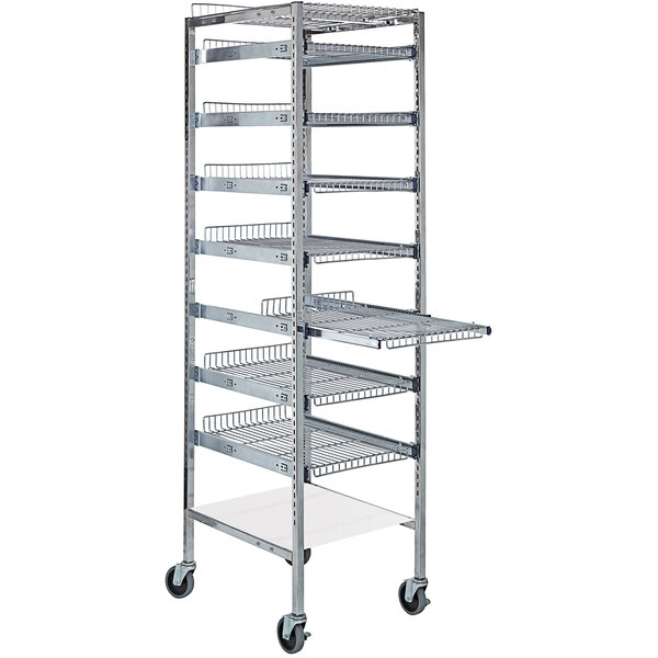 A chrome metal Quantum medical starter rack with wire shelves on wheels.