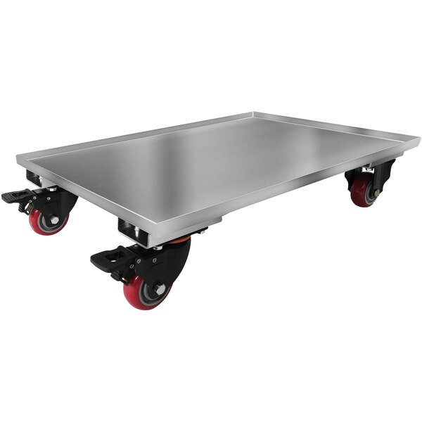 A stainless steel tray for a Spaceman countertop machine on red wheels.