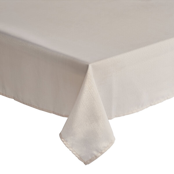 A white rectangular tablecloth with metallic rose gold hemming.