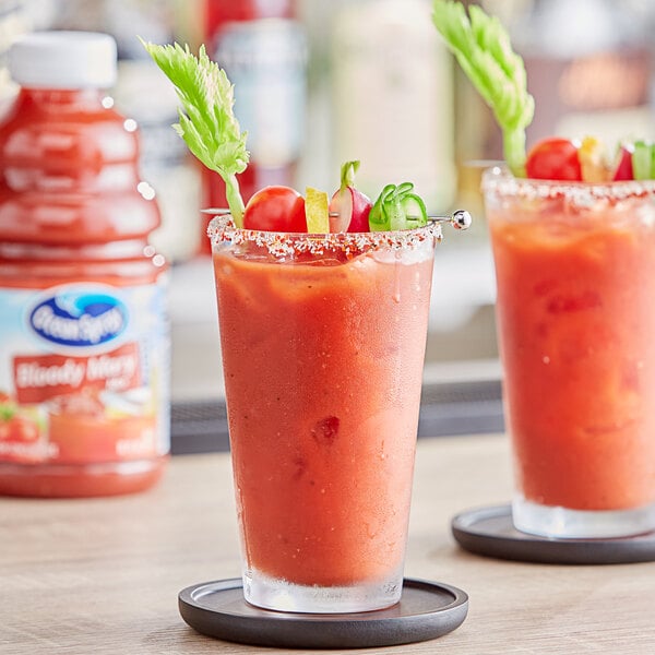 A pair of Ocean Spray Bloody Mary cocktails on a table with a coaster.