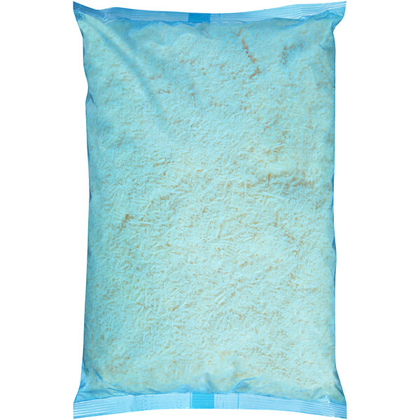 A blue plastic bag of Kraft Shredded Parmesan Cheese with white shredded cheese inside.