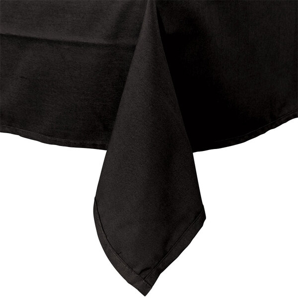 A black Intedge rectangular tablecloth on a table with a folded napkin.