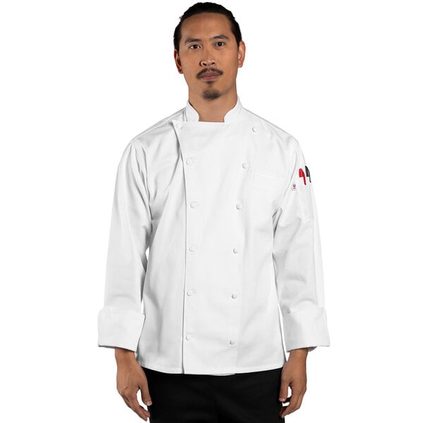 A man wearing a Uncommon Chef long sleeve white chef coat.