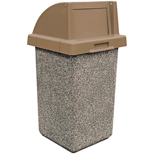 A close-up of a grey and brown Wausau Tile concrete square trash receptacle with a plastic push-door lid.