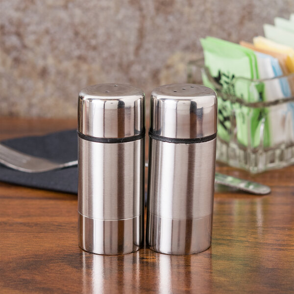 American Metalcraft stainless steel salt and pepper shakers on a table.