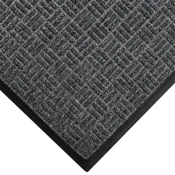 A close-up of a grey WaterHog carpet with black trim.
