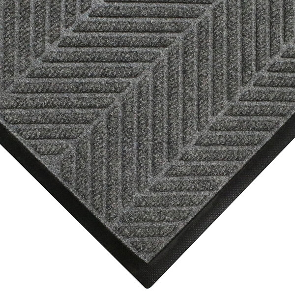 A grey WaterHog mat with a black border.