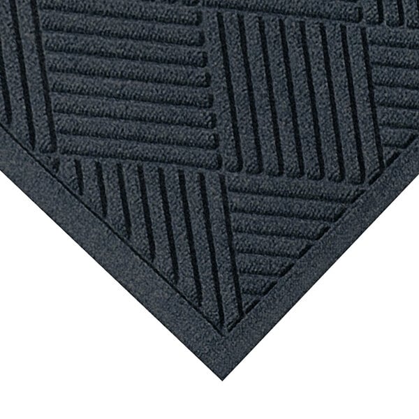 A close-up of a M+A Matting WaterHog Diamond Fashion charcoal mat with a square pattern.