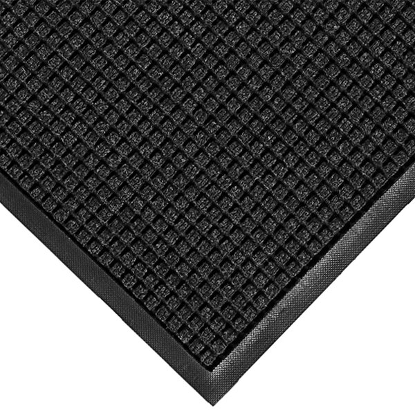 A close-up of a black WaterHog mat with a square pattern.