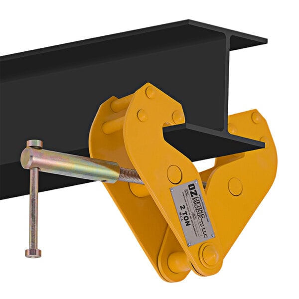 A yellow OZ Lifting beam clamp with a metal hook on top.