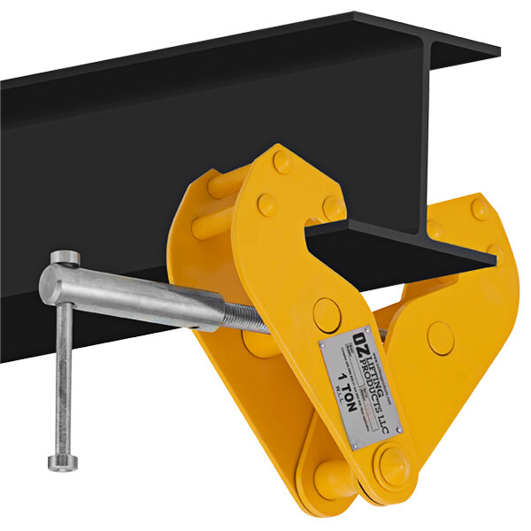 A yellow metal OZ Lifting beam clamp attached to a black metal beam.