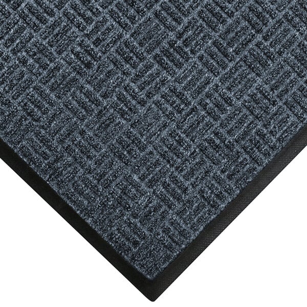 A black and gray WaterHog Ocean Wave carpet mat with a black border.