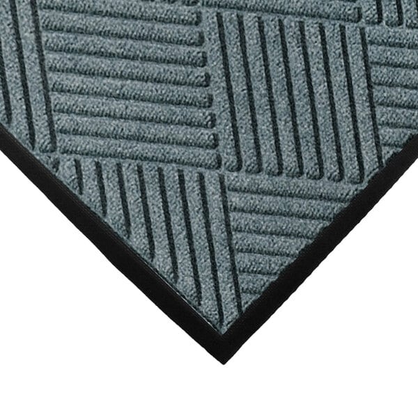 A blue WaterHog mat with a black border.