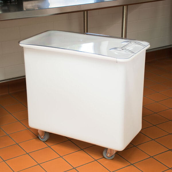 A white Cambro ingredient storage bin with a sliding lid on wheels.