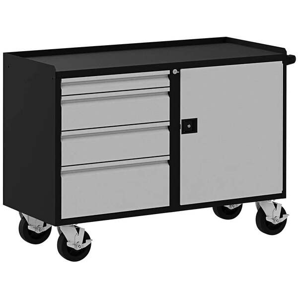 A Valley Craft silver and black metal workbench with drawers and a door.