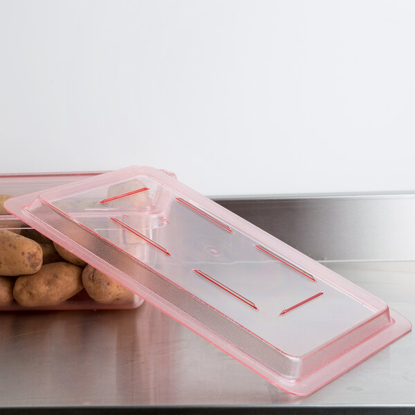 A Cambro plastic food storage box with a flat lid containing potatoes.