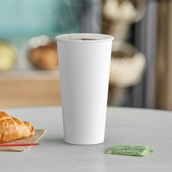 A close-up of a white Choice paper hot cup.