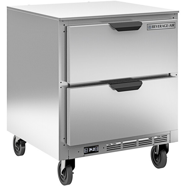 A silver Beverage-Air undercounter refrigerator with two drawers on black wheels.