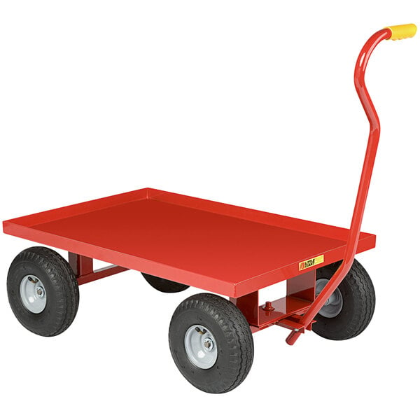 A red metal Little Giant wagon truck with black pneumatic wheels.