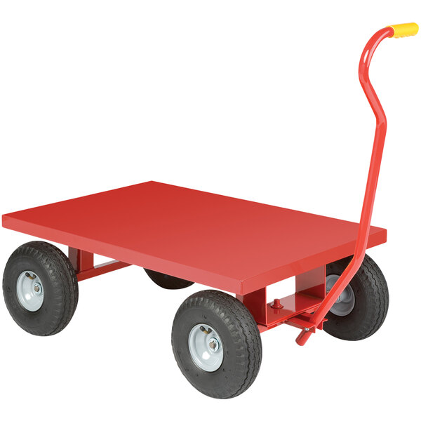 A red metal Little Giant wagon truck with black pneumatic wheels.