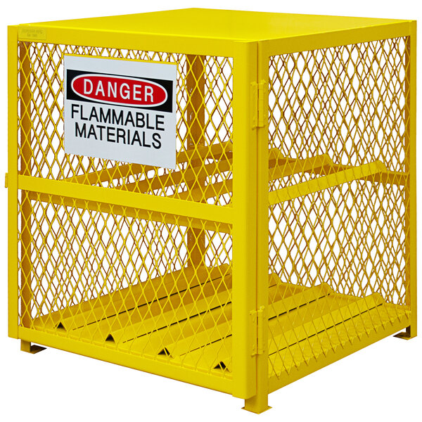 A yellow Durham Manufacturing metal gas cylinder cabinet with a sign.