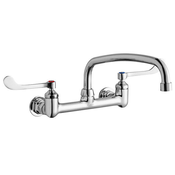 A silver Elkay wall-mounted faucet with two wristblade handles and a swing spout.