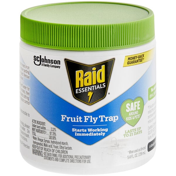 A white SC Johnson Raid fruit fly trap container with a green lid.