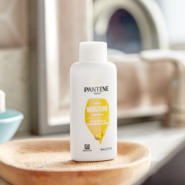 A close-up of a Pantene Pro-V Moisture Renewal shampoo bottle.