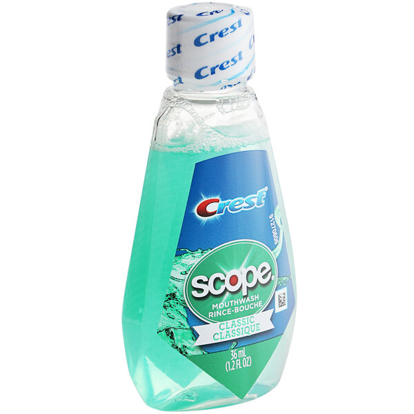 A case of 180 Crest Scope Classic Mint Mouthwash bottles with blue labels.
