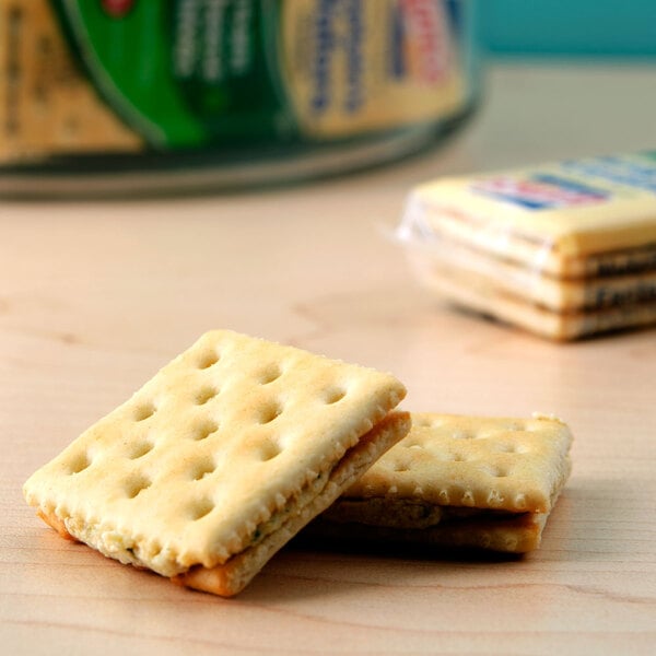 A Lance Captain's Wafers Cream Cheese and Chives sandwich cracker on a table.