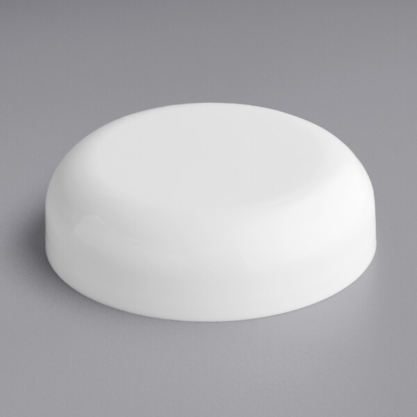 A white plastic round 53/400 dome lid with foam liner.