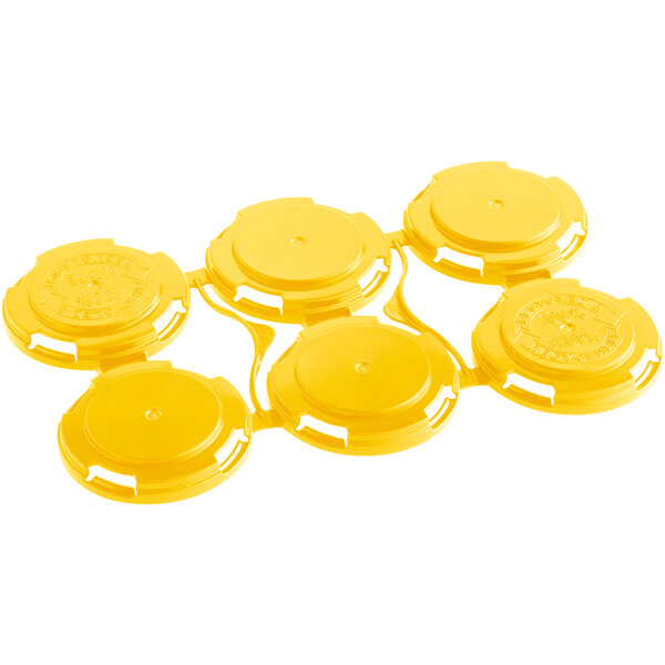 A yellow PakTech plastic 6-pack can carrier with six circles.