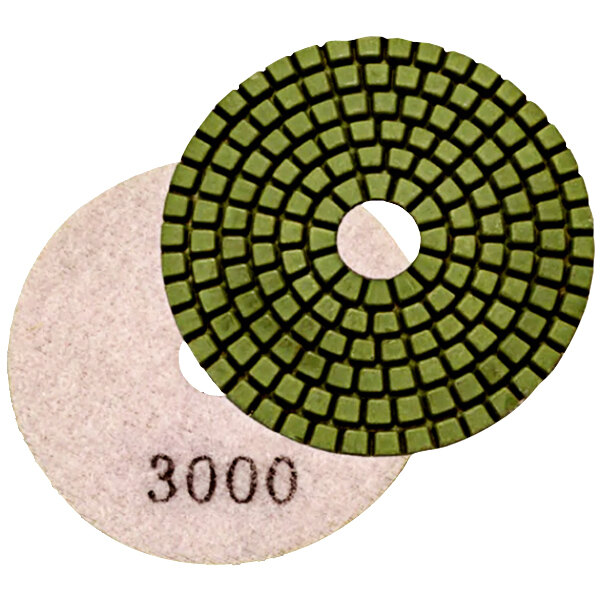 A white circular Onfloor 3000 grit diamond pad with a black circular center.