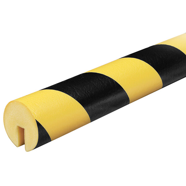 A close up of a yellow and black striped Ideal Warehouse Knuffi edge guard.