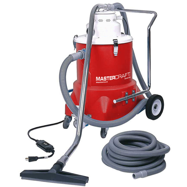 A red and white Mastercraft wet vacuum cleaner with hose and tool kit.