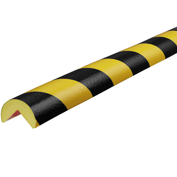 A black and yellow striped rubber corner guard.