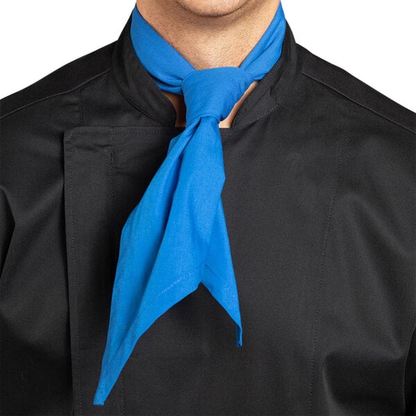 A man wearing a Uncommon Chef royal blue neckerchief over a black shirt.