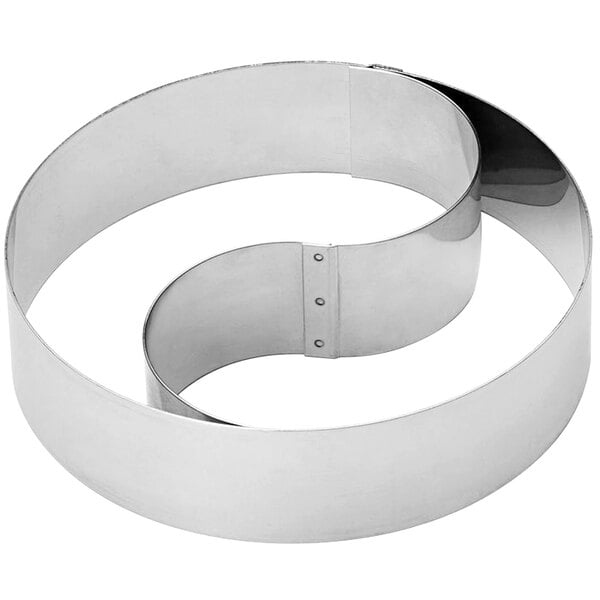 A Gobel stainless steel round mousse ring with a removable divider.