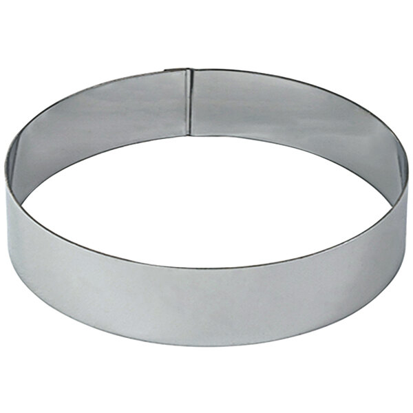 A circular stainless steel mousse ring.