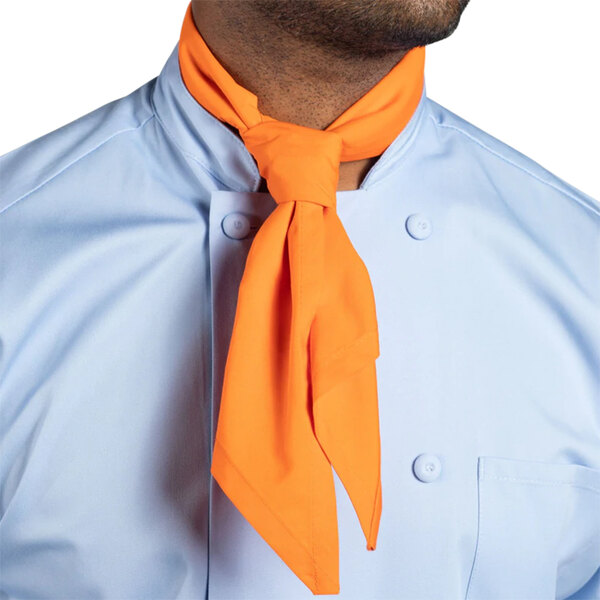 A man wearing an orange carrot print neck scarf.