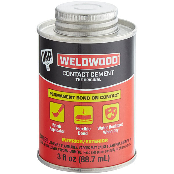 A tan DAP Weldwood contact cement bottle with a red and black label.