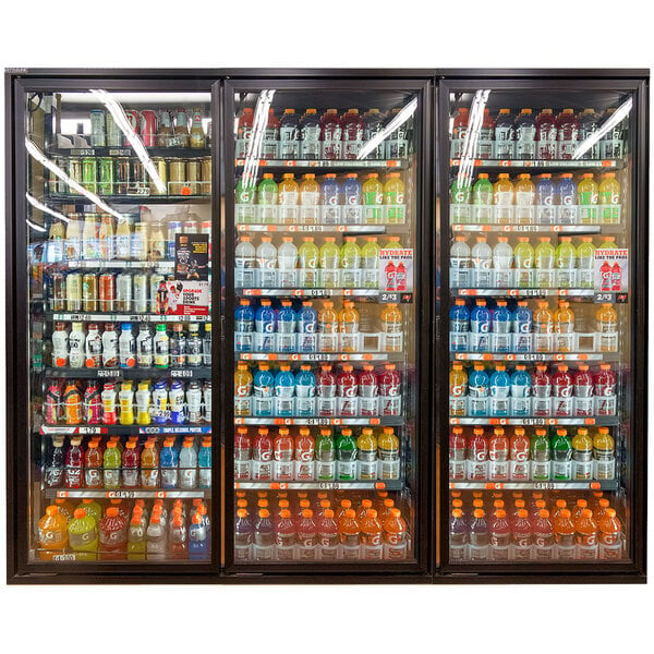 A Styleline walk-in freezer merchandiser door with shelving holding a display case of drinks.