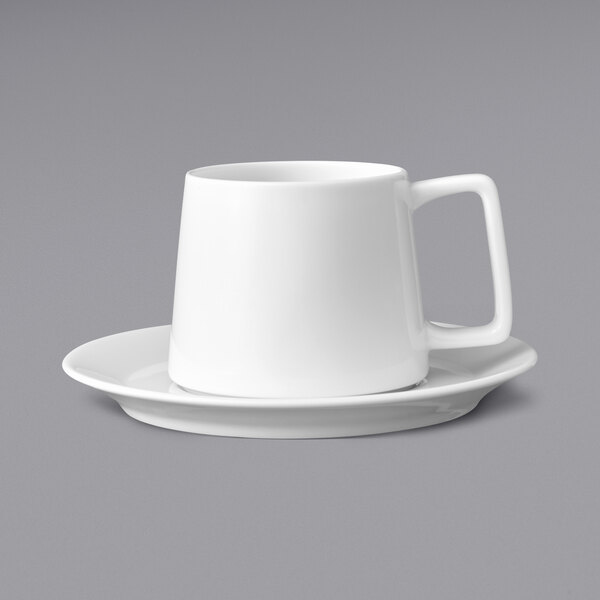 A Oneida Scandi bright white porcelain cappuccino cup on a saucer.