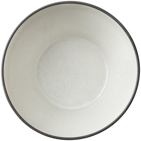 A Dusted White stoneware bowl with a black rim.