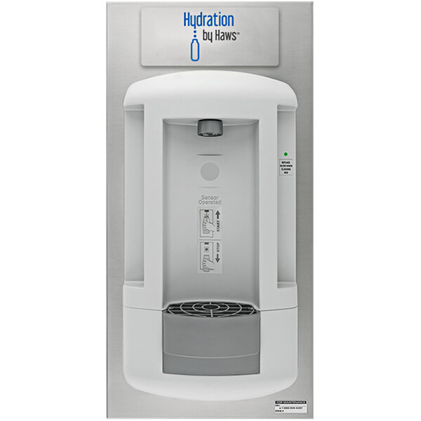 A white Haws touchless bottle filling station recessed into a wall.