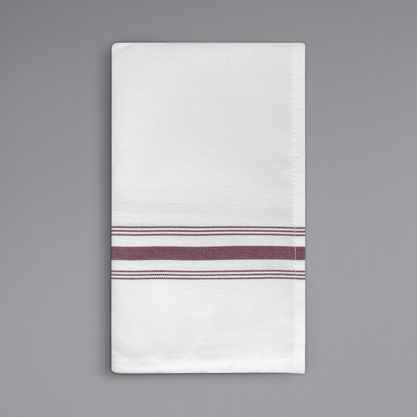 A white cloth napkin with burgundy stripes.