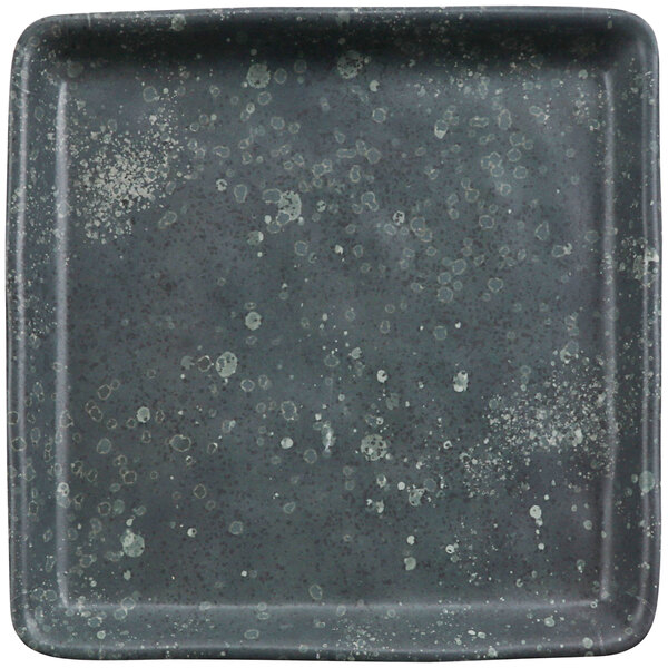 A square gray plate with spruce specks.