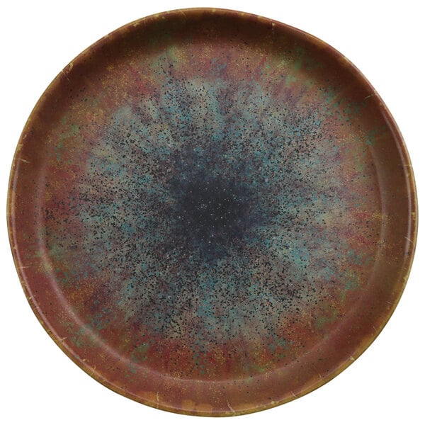 A cheforward round brown melamine plate with a blue and brown speckled design.