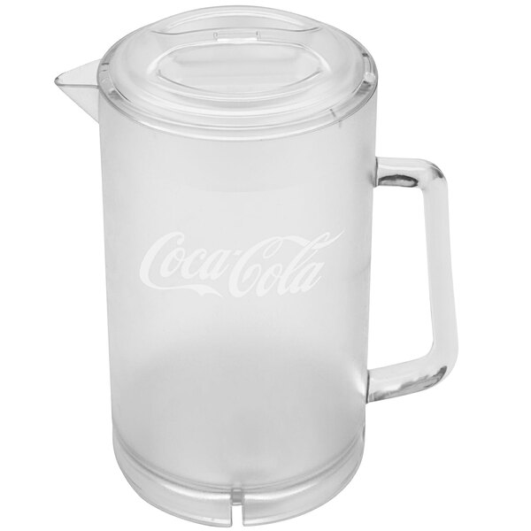 A clear plastic pitcher with a handle and a Coca-Cola logo.